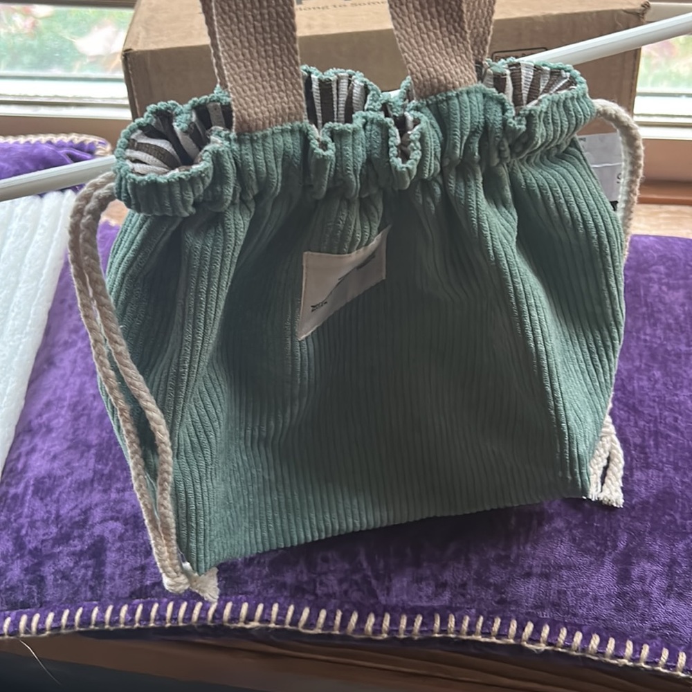 NWT MINT GREEN CORDUROY DRAW STING TOTE/ new/ fall green/ striped interior. Adj